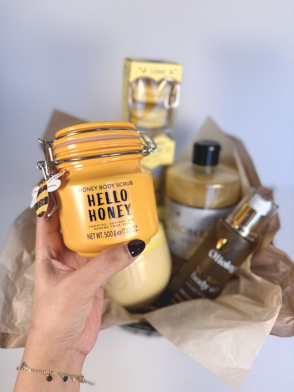 Honey body scrub from a golden self-care basket